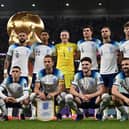 England players pose for a squad photo ahead of their Group B clash with Wales - with a 3-0 victory in the game setting up a last-16 tie with Senegal. (Photo by PAUL ELLIS/AFP via Getty Images)