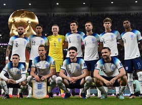 England players pose for a squad photo ahead of their Group B clash with Wales - with a 3-0 victory in the game setting up a last-16 tie with Senegal. (Photo by PAUL ELLIS/AFP via Getty Images)