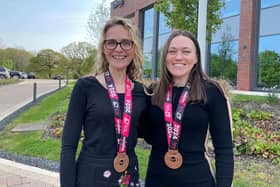 Bellway's Amber Britton-Dyer and Ashleigh Nithsdale with their medals from the London Marathon