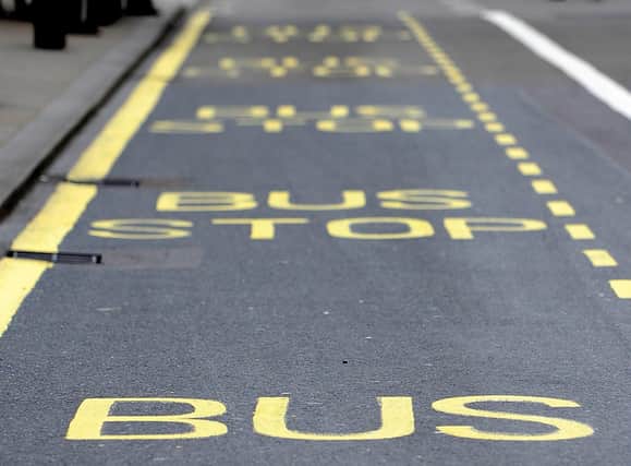 A stock picture of lines painted on the road of a bus stop on Parliament Street in London.
