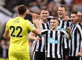 Nick Pope of Newcastle United joins in with the celebrations as team mates Sven Botman, Kieran Trippier, Dan Burn and Fabian Schar celebrates their side's win after the final whistle of the Premier League match between Newcastle United and Everton FC at St. James Park on October 19, 2022 in Newcastle upon Tyne, England. (Photo by George Wood/Getty Images)