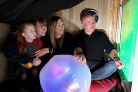 A Scotswood Village Nursery pupil joined in the sensory room by (L-R) nursery teachers Jen Rodden and Caroline Duncan and NTWDC Director, Lee McGray.