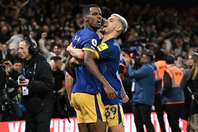 Newcastle United striker Alexander Isak celebrates his winner with Bruno Guimaraes.