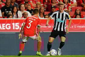 Emil Krafth of Newcastle United FC with Alex Grimaldo of SL Benfica in action during the Eusebio Cup match between SL Benfica and Newcastle United at Estadio da Luz on July 26, 2022 in Lisbon, Portugal.  (Photo by Gualter Fatia/Getty Images)