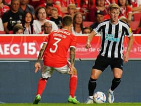 Emil Krafth of Newcastle United FC with Alex Grimaldo of SL Benfica in action during the Eusebio Cup match between SL Benfica and Newcastle United at Estadio da Luz on July 26, 2022 in Lisbon, Portugal.  (Photo by Gualter Fatia/Getty Images)