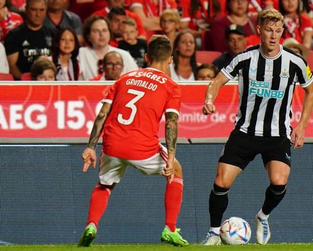 Emil Krafth of Newcastle United FC with Alex Grimaldo of SL Benfica in action during the Eusebio Cup match between SL Benfica and Newcastle United at Estadio da Luz on July 26, 2022 in Lisbon, Portugal.  (Photo by Gualter Fatia/Getty Images)