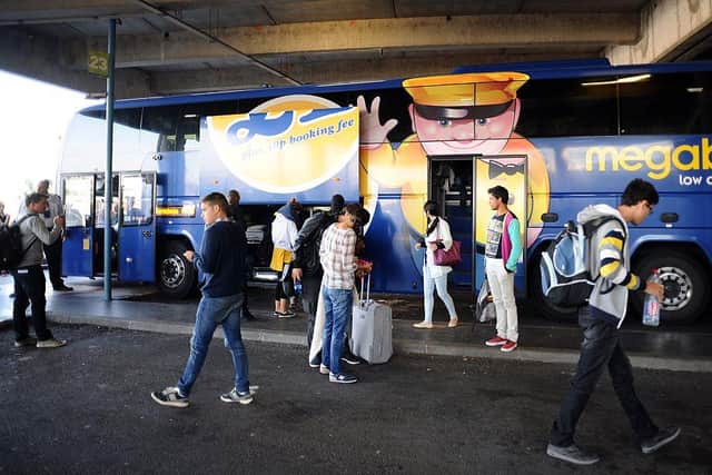 Passengers board a coach of British bus company Megabus (photo: REMY GABALDA/AFP via Getty Images)