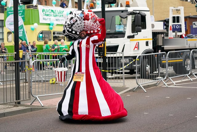 Colin Burgin-Plews also known as Big Pink Dress, regularly takes part in the Great North Run wearing huge handmade dresses, and raises money for charity.