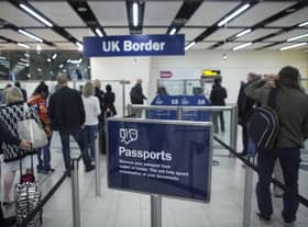 Border Force check the passports of passengers arriving. Photo: Getty Images