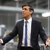 Rishi Sunak talks to local business leaders during a visit to a Coca-Cola factory in Lisburn, Northern Ireland yesterday (Picture: Liam McBurney/WPA pool/Getty Images)
