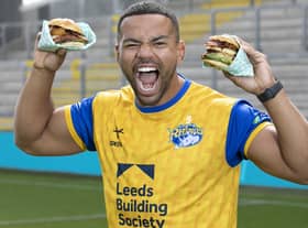 First men’s team captain of the Leeds Rhinos, Kruise Leeming, ‘try-s and tastes’ new Deliveroo x Hooyah Burgers exclusive Leeds Rhinos burger ahead of its launch on National Burger Day, August. 25 (photo: Doug Jackson/PinPep)