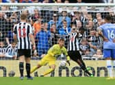 Newcastle United's Swedish striker Alexander Isak (2R) scores a penalty during the English Premier League football match between Newcastle United and AFC Bournemouth at St James' Park in Newcastle-upon-Tyne, north east England on September 17, 2022. (Photo by LINDSEY PARNABY/AFP via Getty Images)