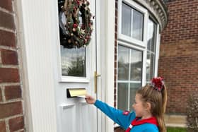 Beaver Scout delivers Christmas card