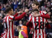 Sander Berge of Sheffield United (R) celebrates after scoring the opening goal against Swansea City at Bramall Lane: Andrew Yates / Sportimage