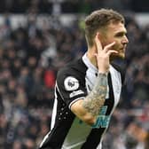 Newcastle United's English defender Kieran Trippier celebrates after scoring the opening goal during the English Premier League football match between Newcastle United and Aston Villa at St James' Park in Newcastle-upon-Tyne, north east England on February 13, 2022. (Photo by OLI SCARFF/AFP via Getty Images)