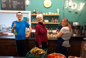 King's Cafe volunteer Lewis Boshier (left) and manager Alison Thompson (right) with Kate Culverhouse, community relations manager at the Banks Group