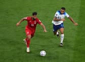 Hossein Kanani of IR Iran and Callum Wilson of England compete for the ball during the FIFA World Cup Qatar 2022 Group B match between England and IR Iran at Khalifa International Stadium on November 21, 2022 in Doha, Qatar. (Photo by Justin Setterfield/Getty Images)