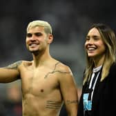 Newcastle United's Brazilian midfielder Bruno Guimaraes and his girlfriend Ana Lidia Martins applauds the fans following the English Premier League football match between Newcastle United and Arsenal at St James' Park in Newcastle-upon-Tyne, north east England on May 16, 2022. (Photo by OLI SCARFF/AFP via Getty Images)