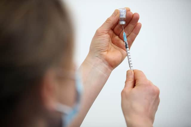 File photo dated 19/02/21 of a Pfizer/BioNTech Covid-19 vaccine being prepared. All 16 and 17-year-olds in England will be offered their first Covid jab by August 23, under a new target set by the Health Secretary Sajid Javid, who has said offering young people the vaccine by this date will allow those teenagers in that age bracket the two weeks necessary to build maximum immunity before returning to school in September. Issue date: Sunday August 15, 2021.