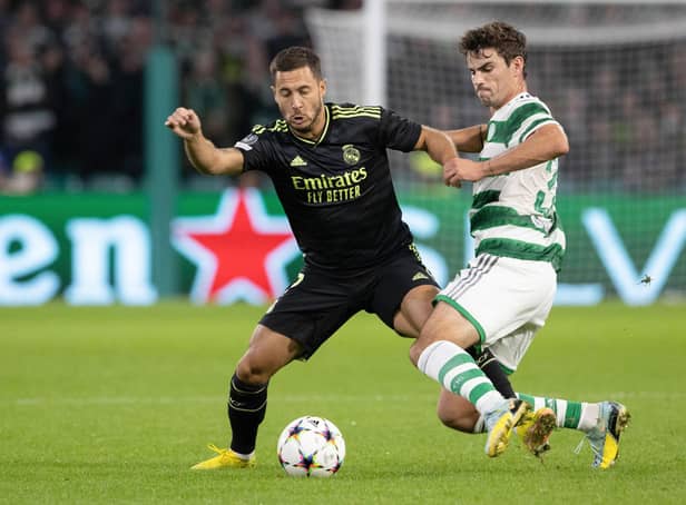 <p>Celtic's Matt O'Riley challenges Eden Hazard of Real Madrid during the Champions League match at Parkhead on Tuesday. (Photo by Alan Harvey / SNS Group)</p>
