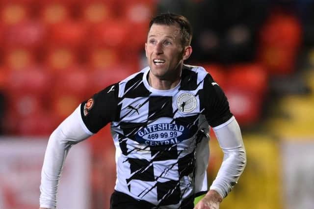 Gateshead player-manager Mike Williamson in action last season.