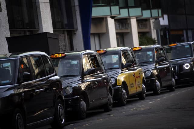 A queue of black cabs outside Victoria Station, London. London taxi drivers are facing long waits for a single fare after the industry has seen a severe drop in demand as coronavirus restrictions continue to reduce travel and office working.