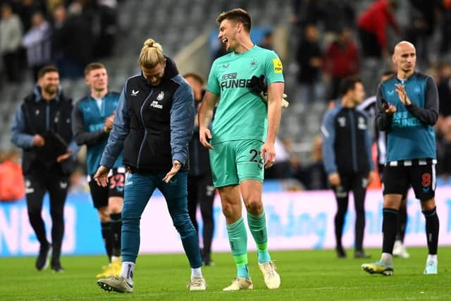 Nick Pope of Newcastle United interacts with Loris Karius of Newcastle United following their sides victory after the Carabao Cup Third Round match between Newcastle United and Crystal Palace at St James' Park on November 09, 2022 in Newcastle upon Tyne, England. (Photo by Stu Forster/Getty Images)