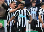 Newcastle United's Swedish striker Alexander Isak (C) celebrates after scoring the opening goal of the English Premier League football match between Newcastle United and Wolverhampton Wanderers at St James' Park in Newcastle-upon-Tyne, north-east England on March 12, 2023. (Photo by Lindsey Parnaby / AFP)