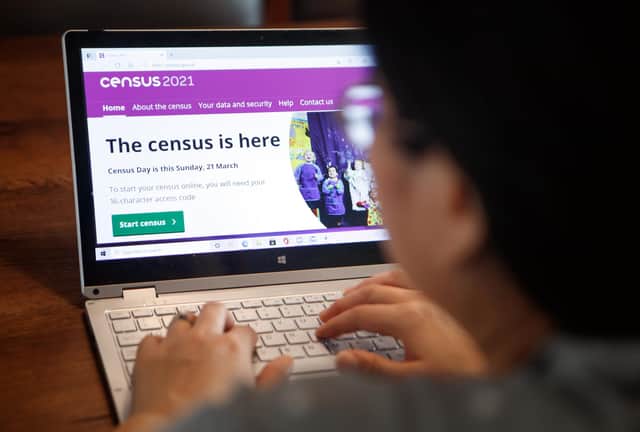 A woman logs on to the Census 2021 website ahead of all households being asked to complete the census ahead of Census Day on Sunday. Picture date: Saturday March 20, 2021.