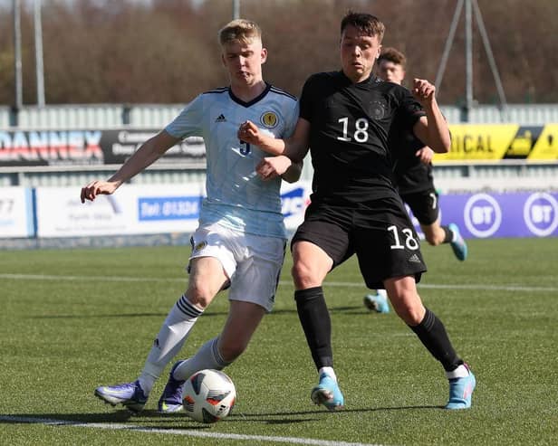 Charlie McArthur of Scotland vies with Dzenan Pecinovic of Germany during the UEFA Under17 European Championship Qualifier match between Germany U17 and Scotland U17 on March 26, 2022 in Glasgow, Scotland. (Photo by Ian MacNicol/Getty Images)