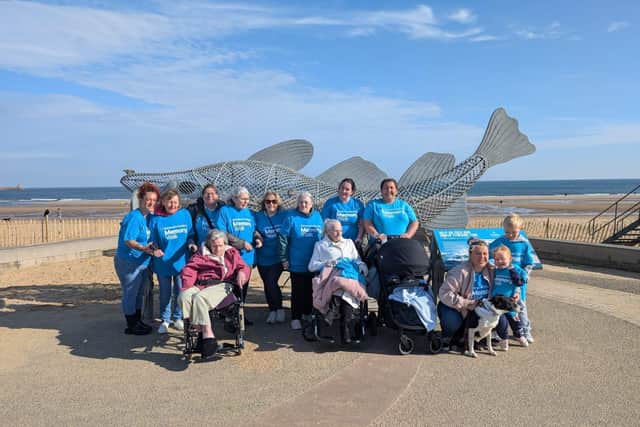 Residents and colleagues by the seaside