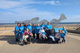 Residents and colleagues by the seaside