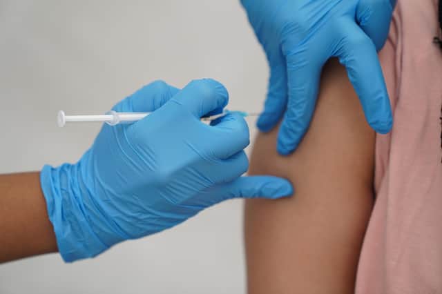 File photo dated 31/07/21 of a person receiving a Covid-19 jab. Campaigners are calling on Scotland's First Minister to send a "clear, personal message" to Boris Johnson that more needs to be done to increase the number of Covid vaccines available in poorer nations. Nicola Sturgeon is being urged to intervene and tell the Prime Minister that if he fails to act on this issue he will be "standing on the wrong side of history and Scotland will not stand alongside him".