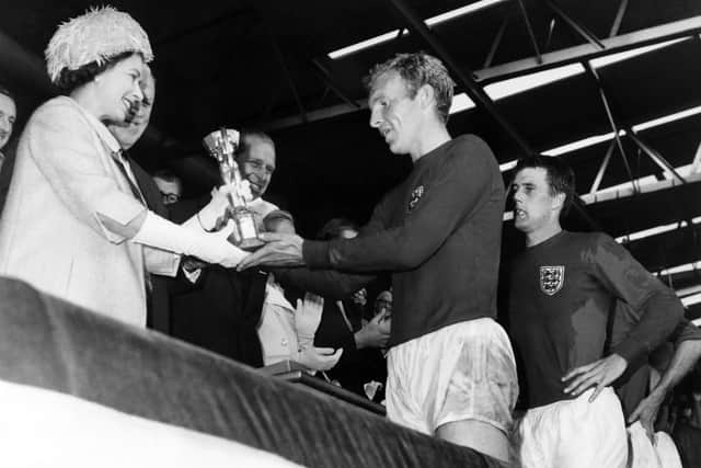 Queen Elizabeth II presents the World Cup to England captain at Wembley in 1966. Photo: AFP via Getty Images.