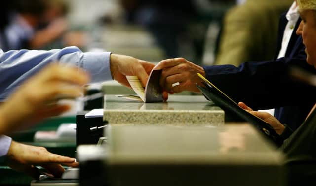 Passports are checked at passport control during the official launch of the UK Border Agency (UKBA) at Gatwick Airport in West Sussex.