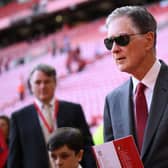 Liverpool's US owner John W. Henry leaves his seat after the English Premier League football match between Liverpool and Bournemouth at Anfield in Liverpool, north west England on August 27, 2022. - Liverpool won the game 9-0. (Photo by OLI SCARFF/AFP via Getty Images)