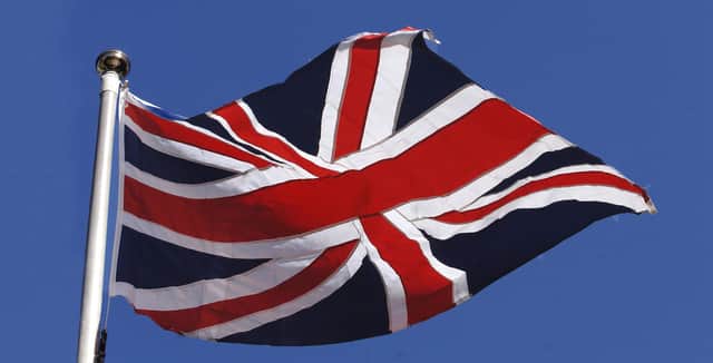 The Union Flag flies at the Queen Elizabeth II Centre in Westmister, central London
