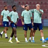 Brazil's forward Vinicius Junior (2nd L), Brazil's midfielder Bruno Guimaraes (C) and Brazil's forward Pedro (R) take part in a training session at Al Arabi SC stadium in Doha on November 23, 2022, on the eve of the Qatar 2022 World Cup football match between Brazil and Serbia. (Photo by NELSON ALMEIDA/AFP via Getty Images)