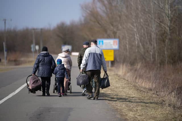 A family of refugees flee the fighting in Ukraine.