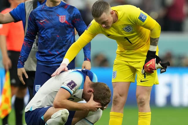 Harry Kane is consoled by team-mate Jordan Pickford after the match on Saturday. Picture: PA.