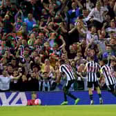 Newcastle United's Alexander Isak celebrates scoring at Anfield.