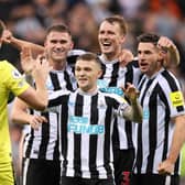 Nick Pope of Newcastle United joins in with the celebrations as team mates Sven Botman, Kieran Trippier, Dan Burn and Fabian Schar celebrates their side's win after the final whistle of the Premier League match between Newcastle United and Everton FC at St. James Park on October 19, 2022 in Newcastle upon Tyne, England. (Photo by George Wood/Getty Images)