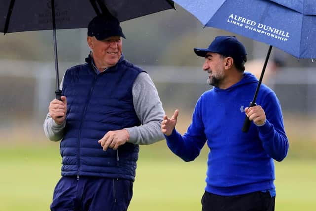 R&A chief executive Martin Slumbers chats to LIV Golf chairman Yasir Al-Rumayyan during their recent round together in the Alfred Dunhill Links Championship at St Andrews. Picture: Stephen Pond/Getty Images.
