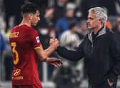Jose Mourinho congratulates Roma's Brazilian defender Roger Ibanez. (Photo by Marco BERTORELLO / AFP) (Photo by MARCO BERTORELLO/AFP via Getty Images)