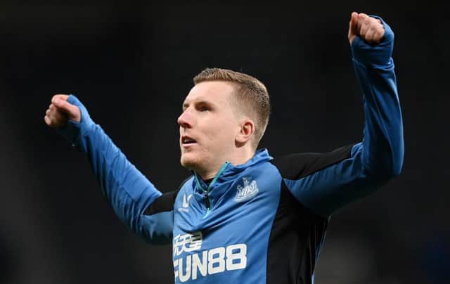 Matt Targett of Newcastle United warms up prior to the Premier League match between Newcastle United and Everton at St. James Park on February 08, 2022 in Newcastle upon Tyne, England. (Photo by Stu Forster/Getty Images)
