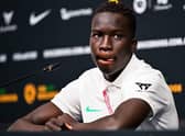 Australia's Garang Kuol attends a press conference in Doha.