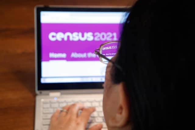 A woman logs on to the Census 2021 website ahead of all households being asked to complete the census ahead of Census Day on Sunday. Picture date: Saturday March 20, 2021.