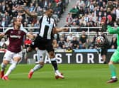 NEWCASTLE UPON TYNE, ENGLAND - AUGUST 15: Callum Wilson of Newcastle United scores their side's first goal past Lukasz Fabianski of West Ham United during the Premier League match between Newcastle United and West Ham United at St. James Park on August 15, 2021 in Newcastle upon Tyne, England. (Photo by Ian MacNicol/Getty Images)