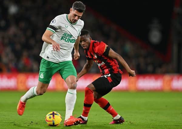 Bournemouth's Ivory Coast midfielder Hamed Traore (R) vies with Newcastle United's Swiss defender Fabian Schar during the English Premier League football match between Bournemouth and Newcastle United at the Vitality Stadium in Bournemouth, southern England on February 11, 2023. (Photo by GLYN KIRK/AFP via Getty Images)