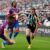 Newcastle United's Elliot Anderson drives forward.